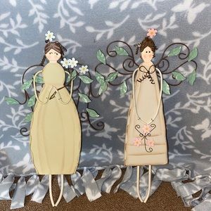 Pair of wooden wall hangings.